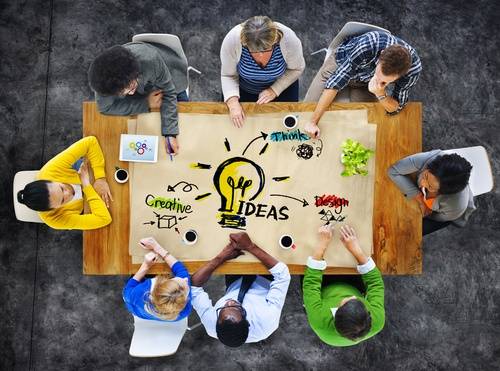 Team of professionals working on a project idea at a table