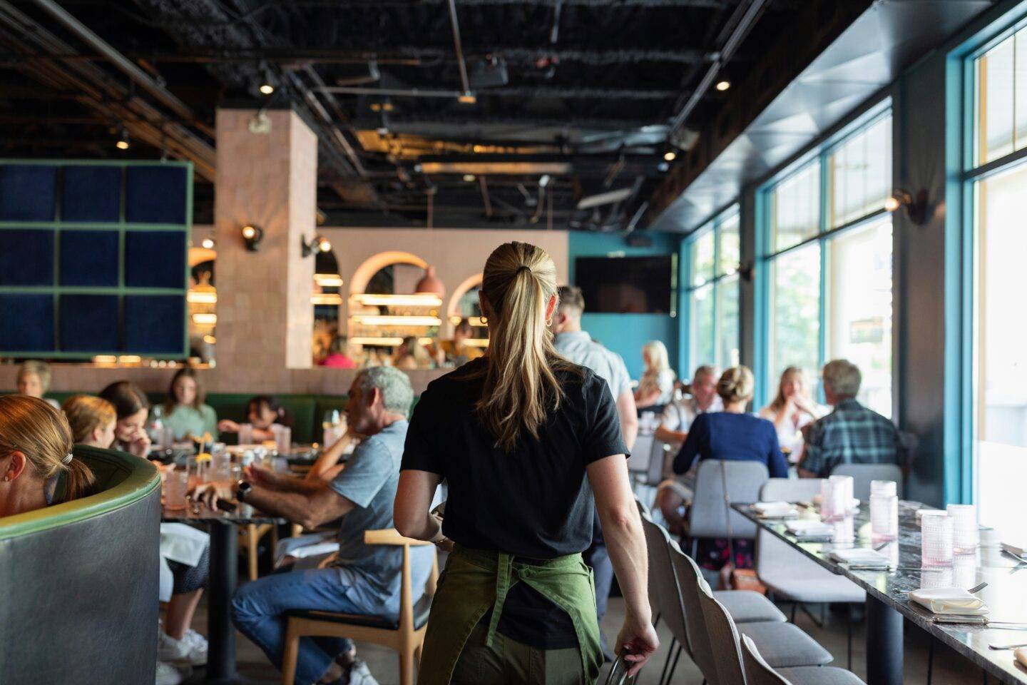 Waitress working in a busy restaurant