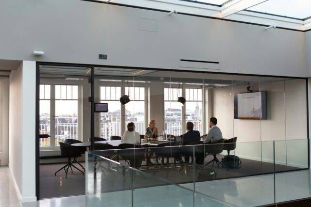 project management team sitting in an office