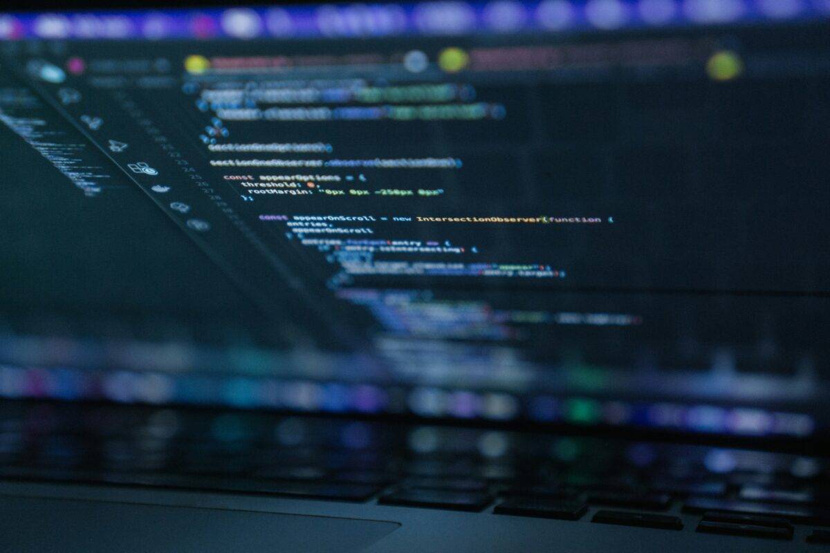 Laptop screen showing computer code